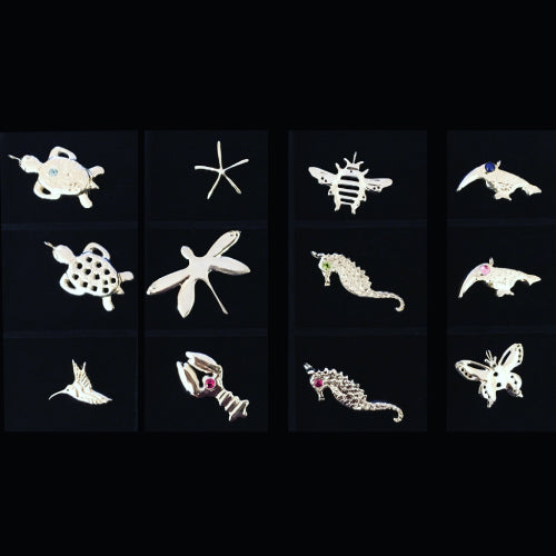 Jewelry assortment in Sterling Silver made by Michele Benjamin includes bumblebee, butterfly, hummingbird, lobster, seahorse, starfish, tortoise and toucan designs all handcarved from wax, cast in sterling using lost wax method, gemstones set, and hand finished. Made in New York, Ships worldwide.  